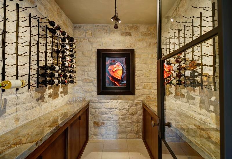 Example of an arts and crafts wine cellar design in Houston