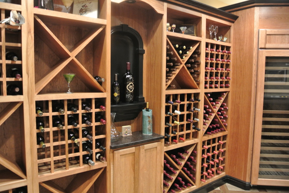 This is an example of a medium sized classic wine cellar in DC Metro with porcelain flooring, cube storage and beige floors.