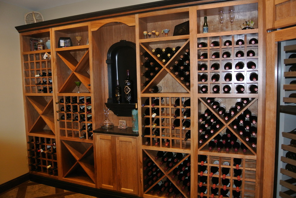 Example of a mid-sized transitional porcelain tile and beige floor wine cellar design in DC Metro with diamond bins