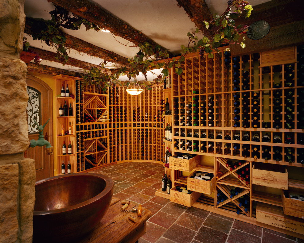 Photo of a mediterranean wine cellar in San Francisco with storage racks.