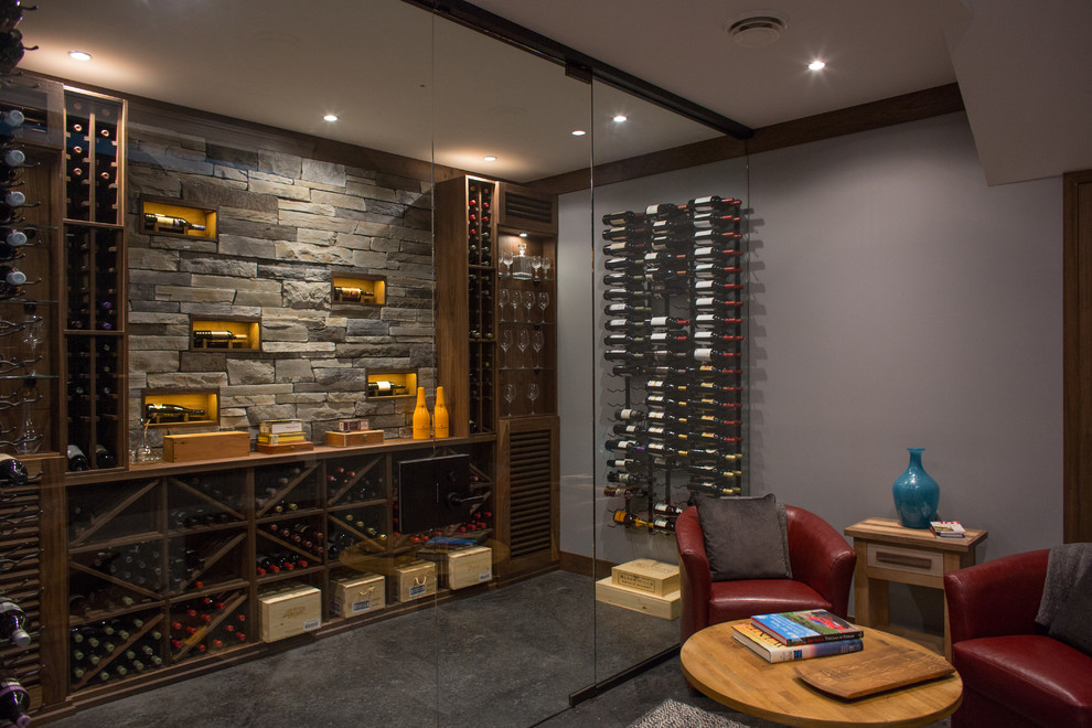 Inspiration for a medium sized classic wine cellar in Vancouver with porcelain flooring, storage racks and grey floors.