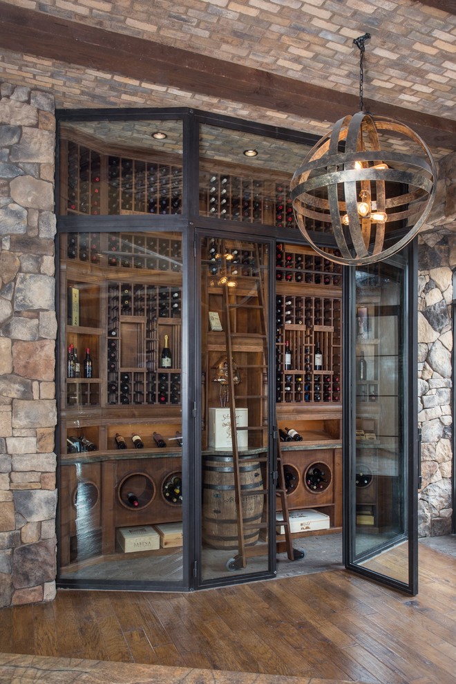 Design ideas for a large classic wine cellar in Phoenix with brick flooring and storage racks.