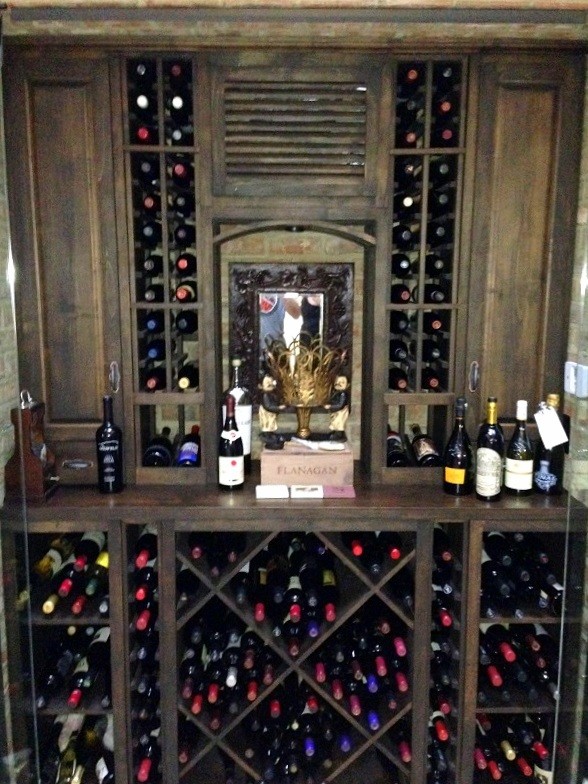 Small elegant wine cellar photo in Orange County with storage racks