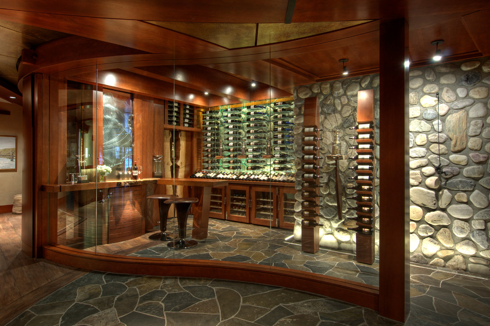 Large contemporary wine cellar in Calgary with display racks.