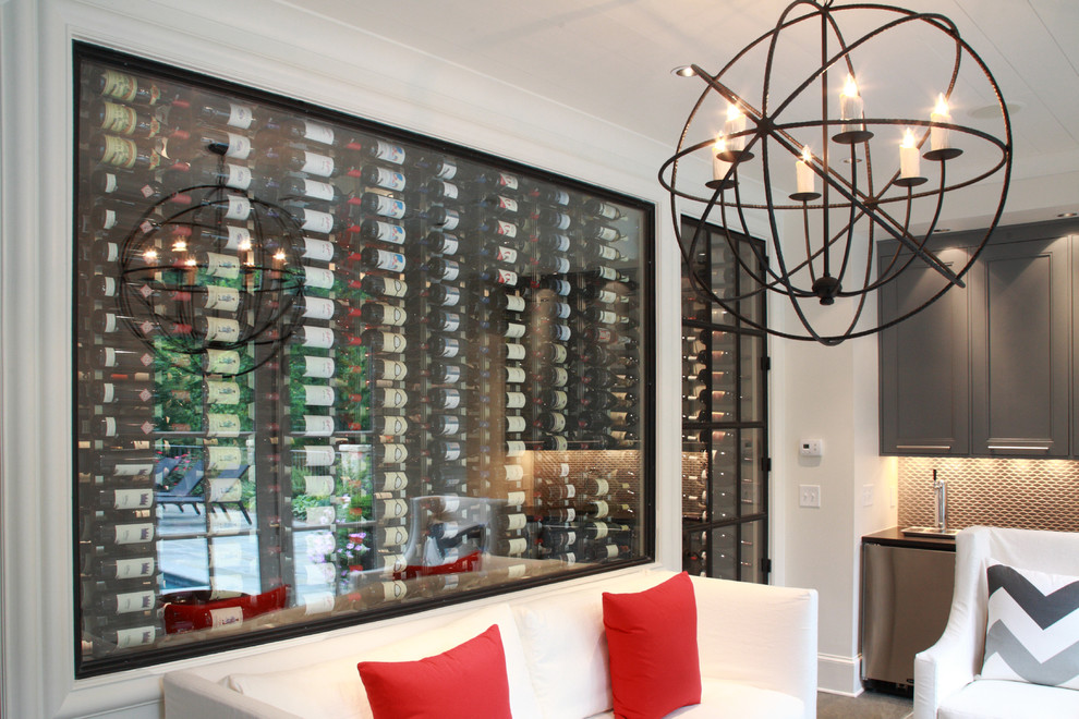 Inspiration for a mid-sized contemporary wine cellar remodel in San Francisco with display racks