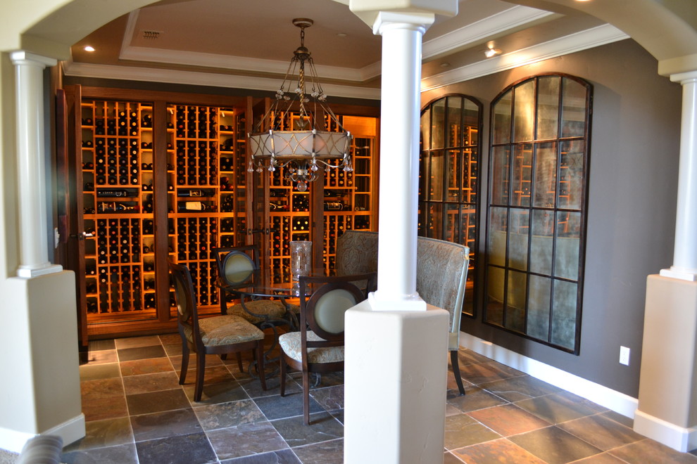 Wine cellar - large traditional slate floor wine cellar idea in Sacramento with storage racks