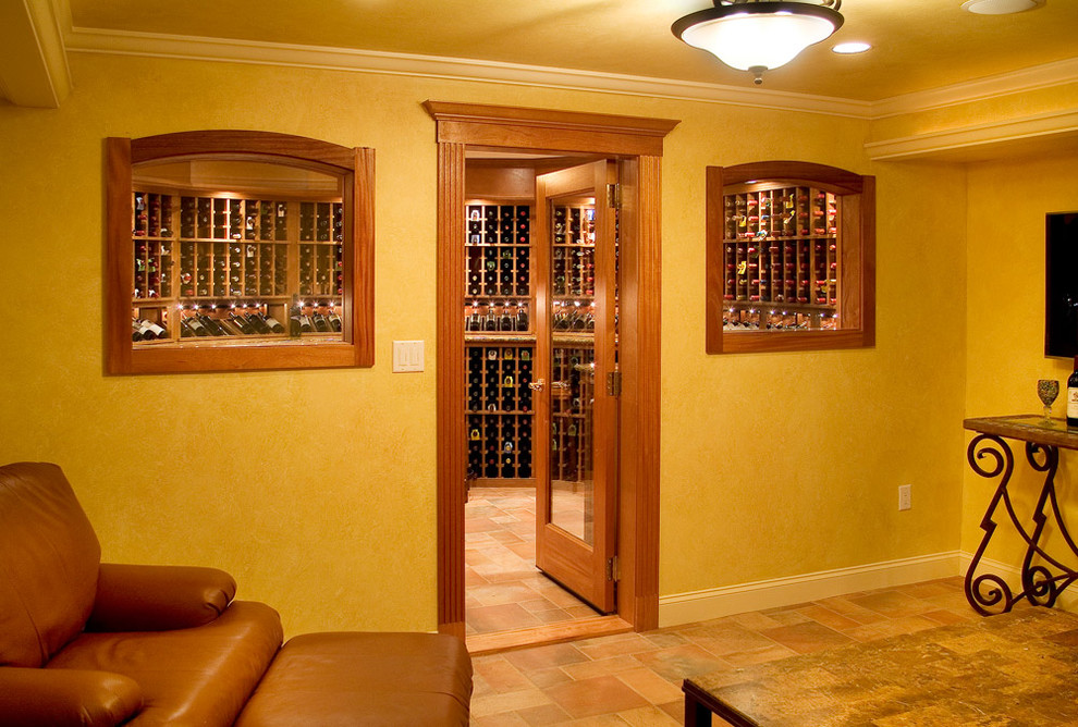 Example of a mountain style wine cellar design in Boston