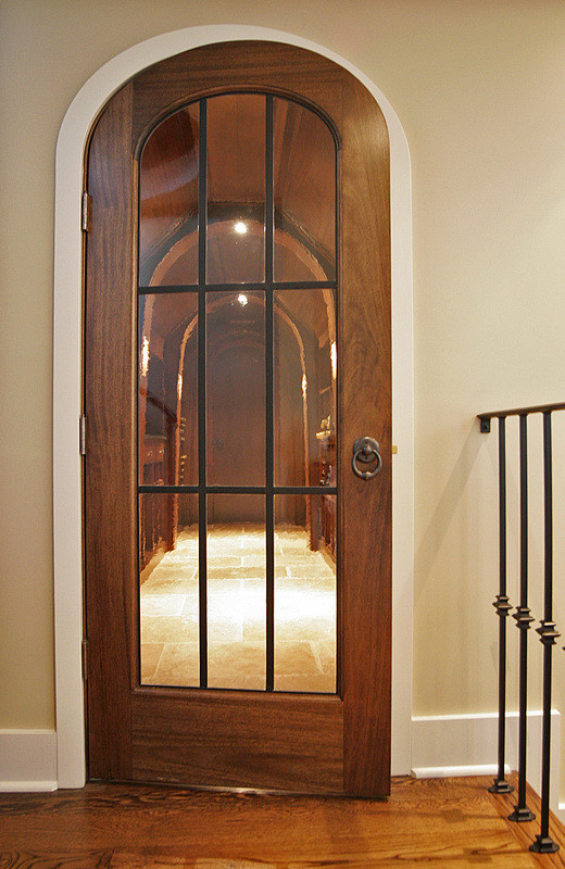 Inspiration for a large timeless travertine floor wine cellar remodel in Charlotte with storage racks