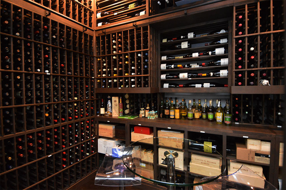 Inspiration for a mid-sized transitional wine cellar remodel in Dallas with storage racks