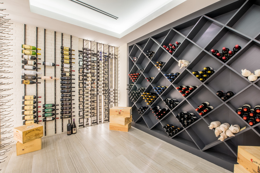 Contemporary wine cellar in Boston with cube storage and beige floors.