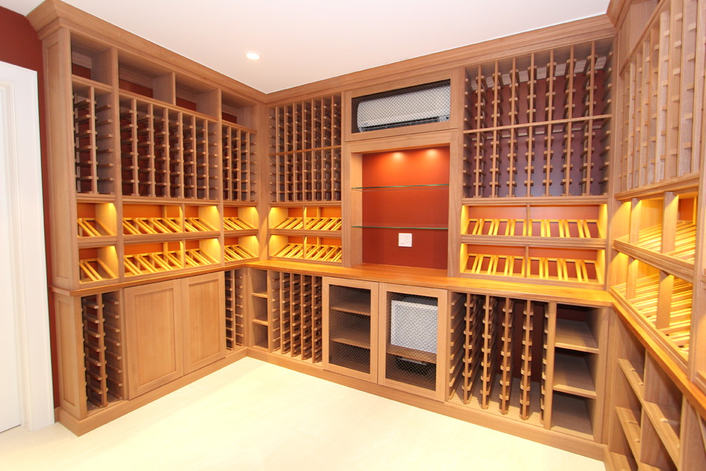 Design ideas for a medium sized contemporary wine cellar in New York with light hardwood flooring, display racks and beige floors.