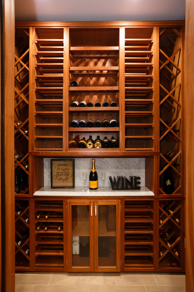 Mid-sized minimalist porcelain tile wine cellar photo in New York with display racks