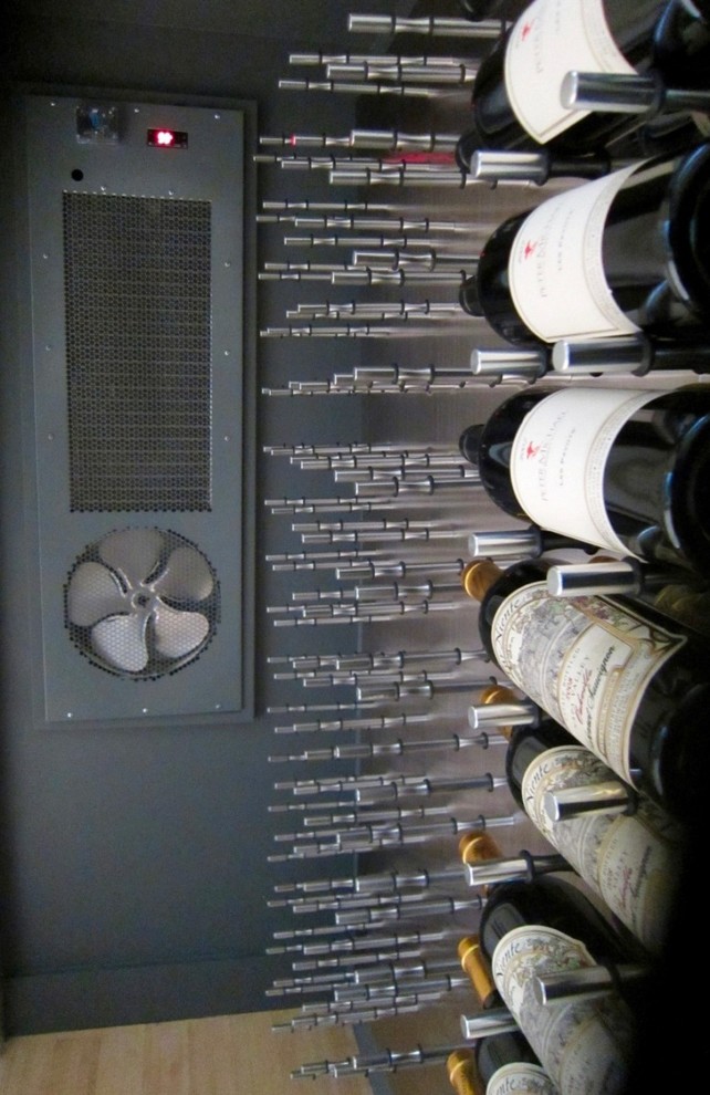 Wine cellar - small contemporary bamboo floor wine cellar idea in Dallas with storage racks