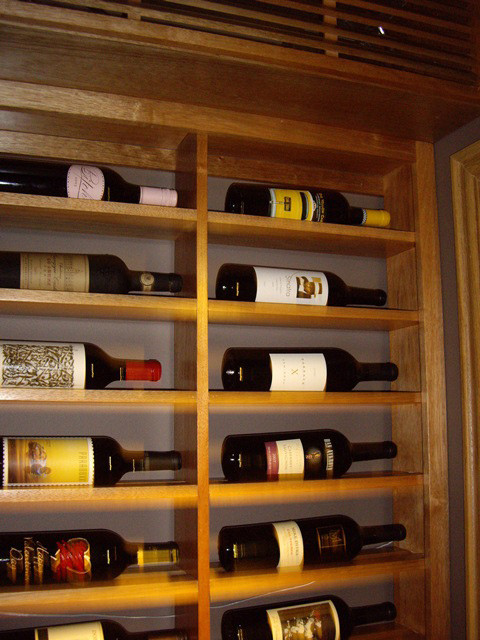 Inspiration for a small timeless wine cellar remodel in Dallas with storage racks