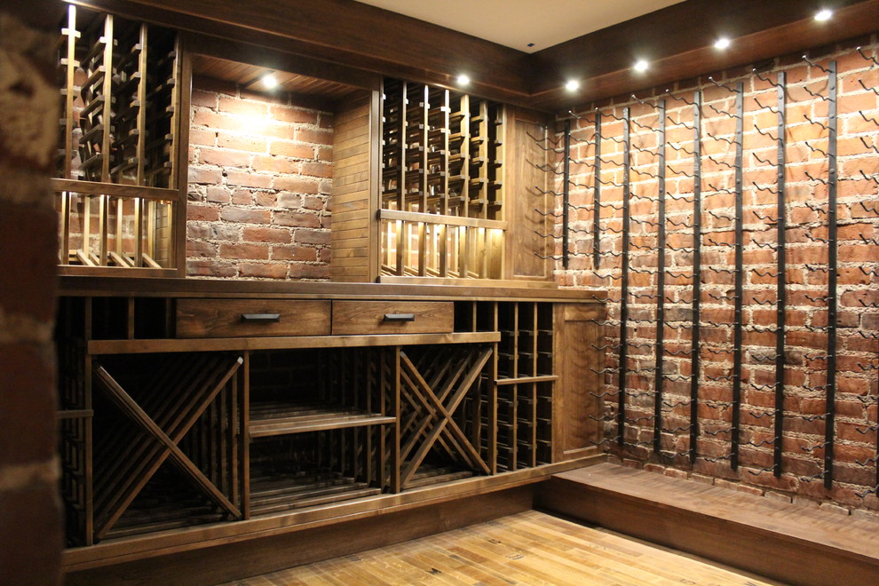 Inspiration for a medium sized traditional wine cellar in Denver with display racks.