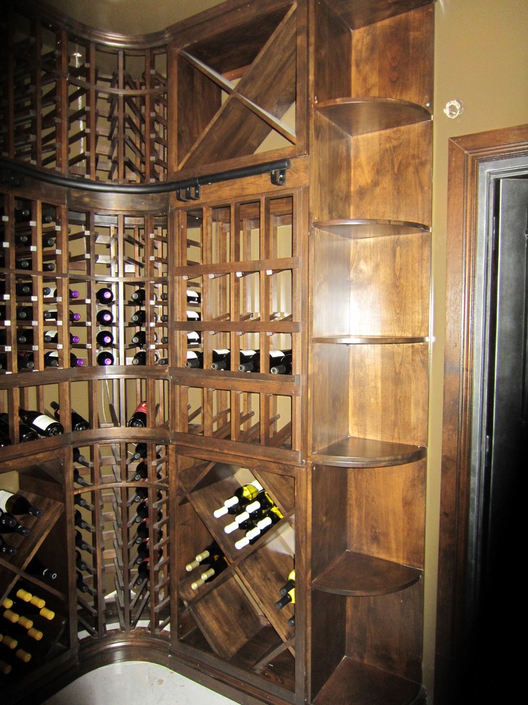 Medium sized classic wine cellar in New Orleans with marble flooring and storage racks.