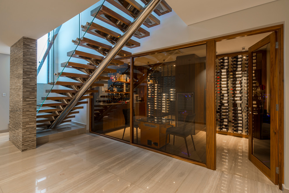 Wine cellar - large contemporary porcelain tile wine cellar idea in Perth with display racks