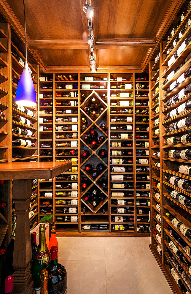 Photo of a small traditional wine cellar in Chicago with display racks.