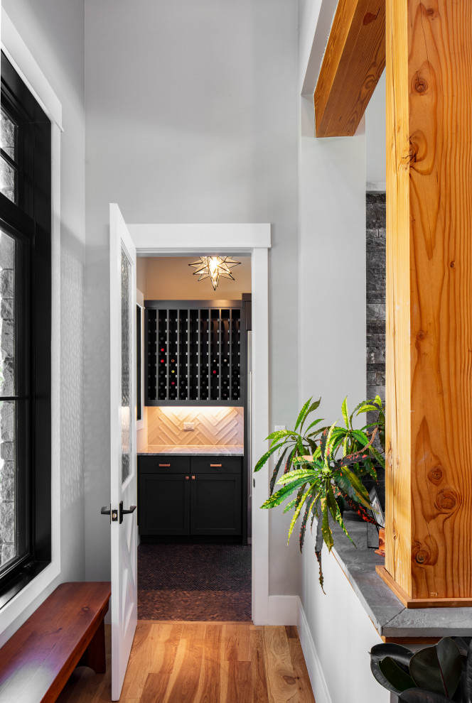 Photo of a country wine cellar in Austin with storage racks.