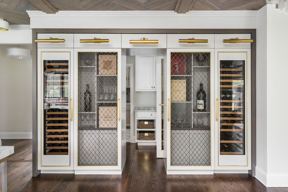 Inspiration for a medium sized traditional wine cellar in Chicago with medium hardwood flooring, brown floors and display racks.