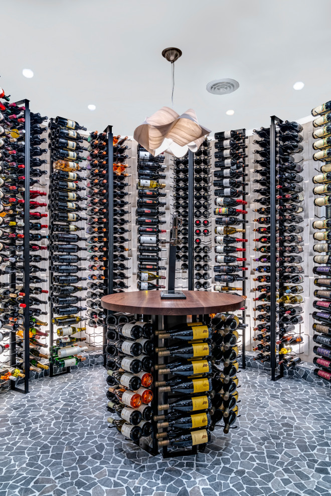 Inspiration for a large contemporary wine cellar in Columbus with display racks.