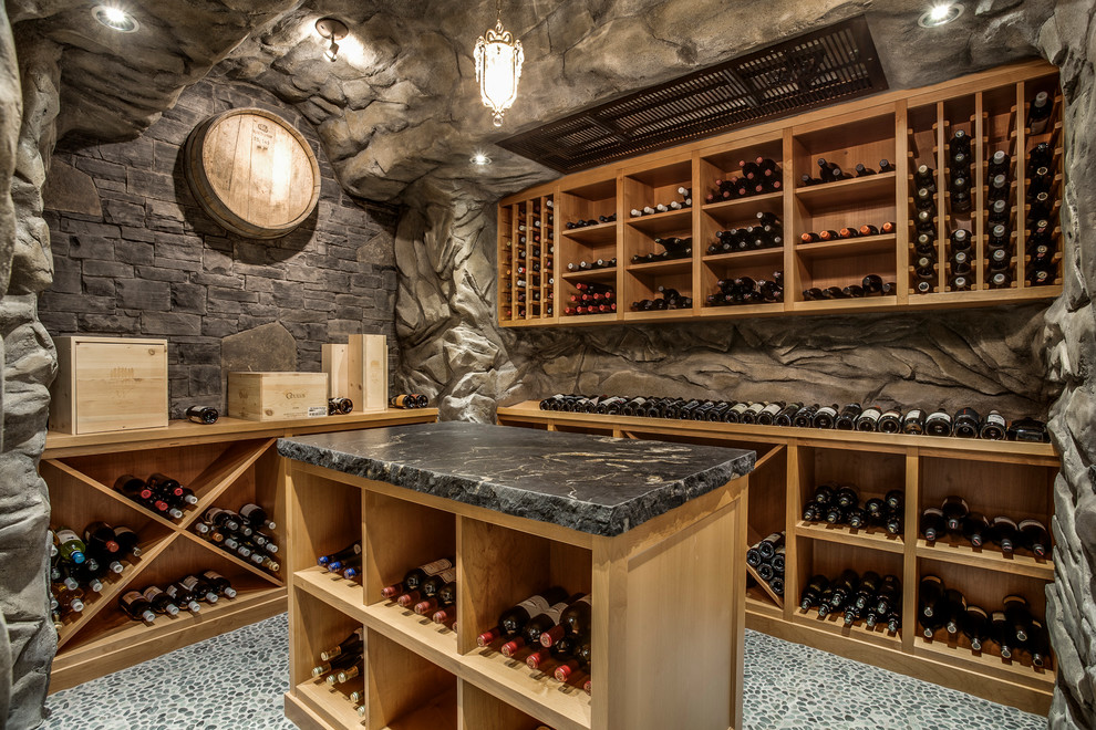 Inspiration for a rustic wine cellar in Vancouver with storage racks.