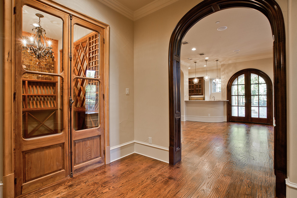 Medium sized traditional wine cellar in Dallas with slate flooring, cube storage and multi-coloured floors.