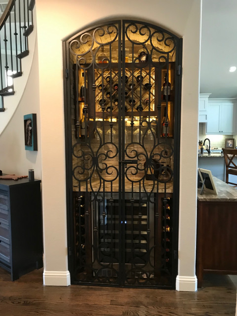 Elegant Wine Closet With Custom Wrought Iron Gates Traditional Wine Cellar Dallas By 