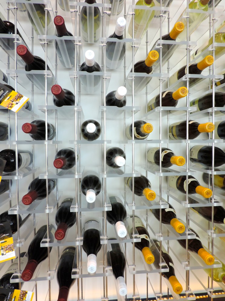 Inspiration for a large contemporary wine cellar remodel in San Francisco with display racks