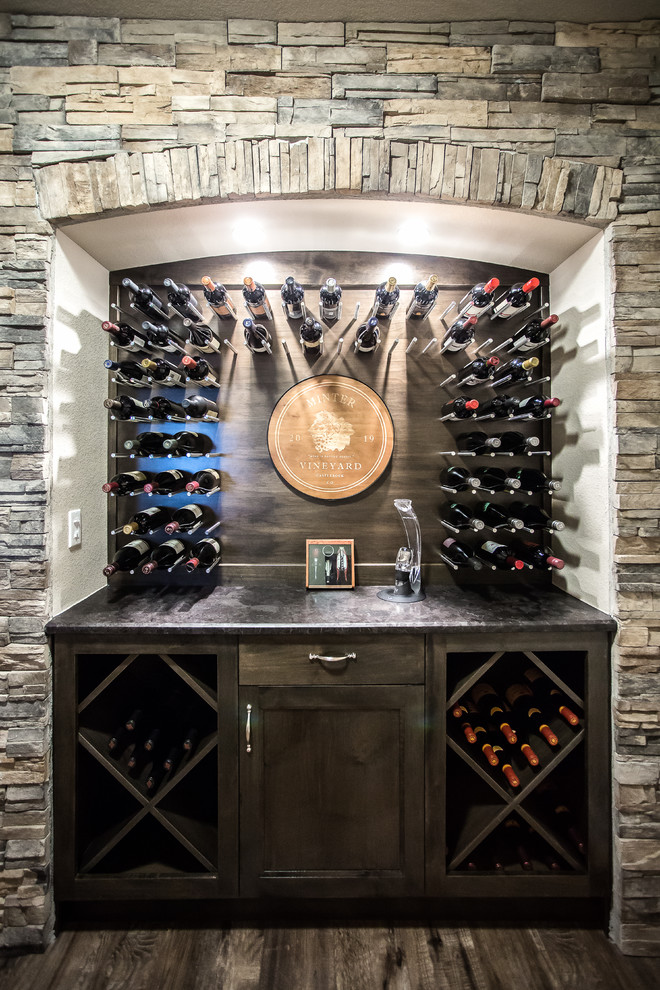 Inspiration for a mid-sized transitional wine cellar remodel in Denver