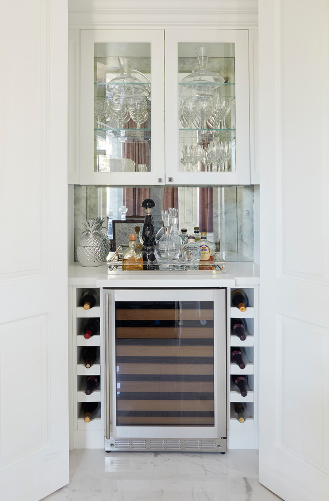 Photo of a small traditional wine cellar in Toronto with porcelain flooring, display racks and multi-coloured floors.