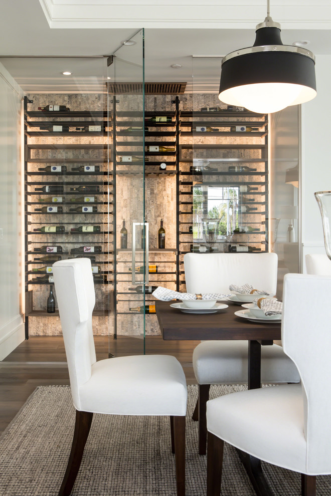 Photo of a small modern wine cellar in Los Angeles with display racks.