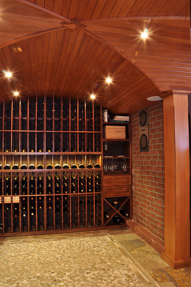 Example of a trendy wine cellar design in Seattle with storage racks