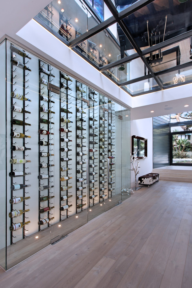 Wine cellar - contemporary gray floor wine cellar idea in Orange County