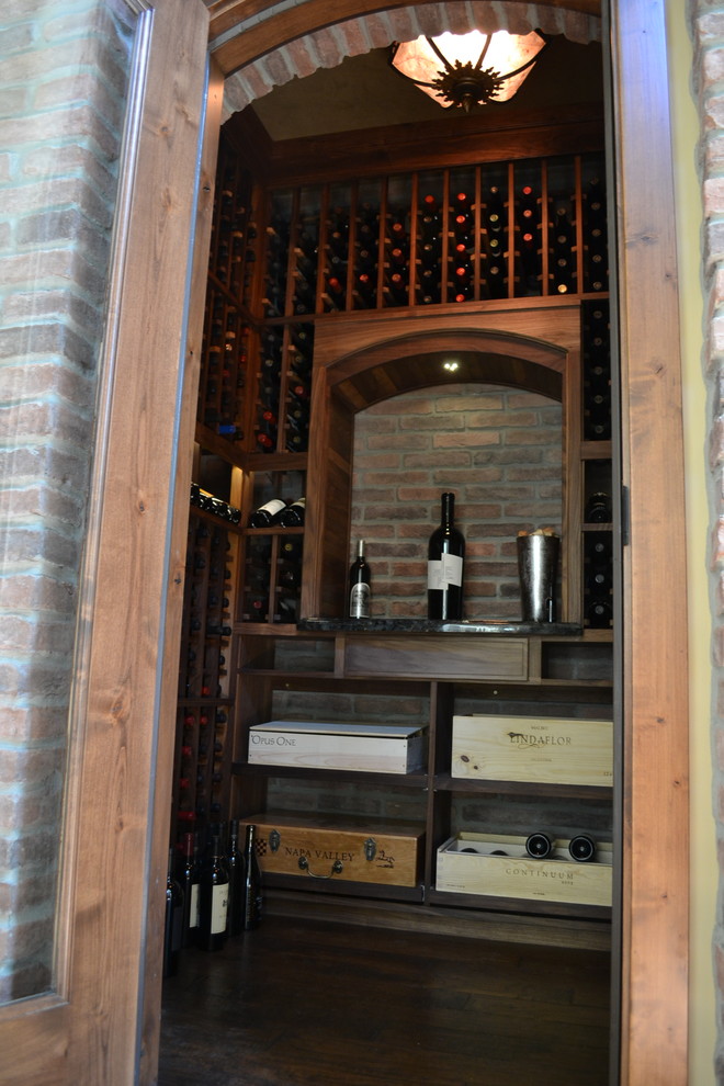 Example of a mid-sized trendy wine cellar design in Sacramento with storage racks