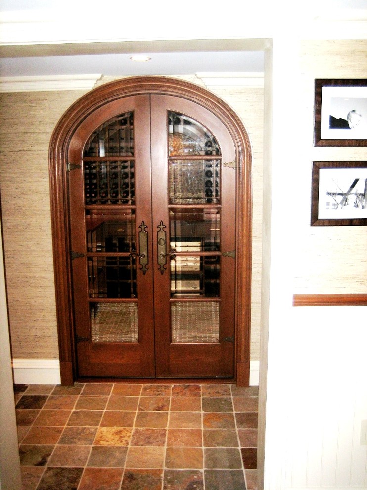 Design ideas for a medium sized traditional wine cellar in Bridgeport with ceramic flooring, storage racks and brown floors.
