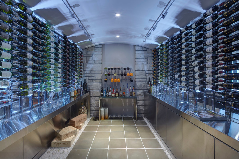 This is an example of a medium sized contemporary wine cellar in Detroit with storage racks.