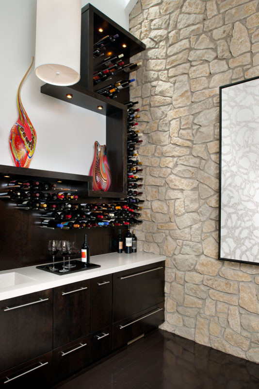 Design ideas for a contemporary wine cellar in Other with brown floors.