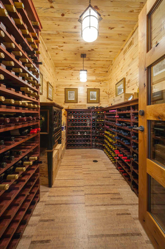 Inspiration for an expansive rustic wine cellar in Other with storage racks and vinyl flooring.