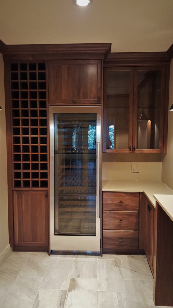 Example of a mid-sized classic porcelain tile and gray floor wine cellar design in Calgary with storage racks