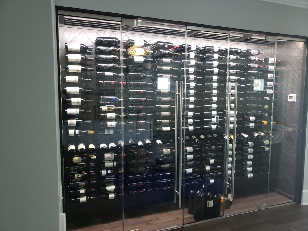 Wine cellar - modern wine cellar idea in Tampa with display racks