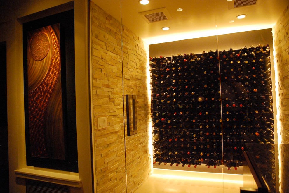 Example of a large trendy wine cellar design in Los Angeles with storage racks