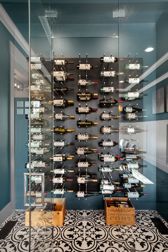 Inspiration for a mid-sized craftsman porcelain tile and multicolored floor wine cellar remodel in Seattle with storage racks