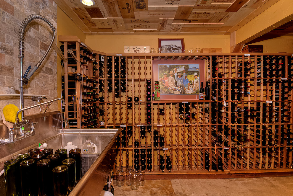 This is an example of an eclectic wine cellar in Seattle.