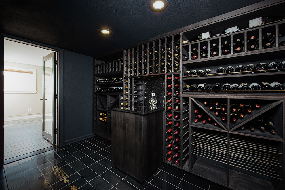 Inspiration for a large modern wine cellar in Portland with ceramic flooring, storage racks and black floors.