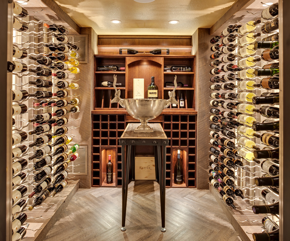 Inspiration for a mid-sized transitional medium tone wood floor and brown floor wine cellar remodel in Minneapolis with display racks