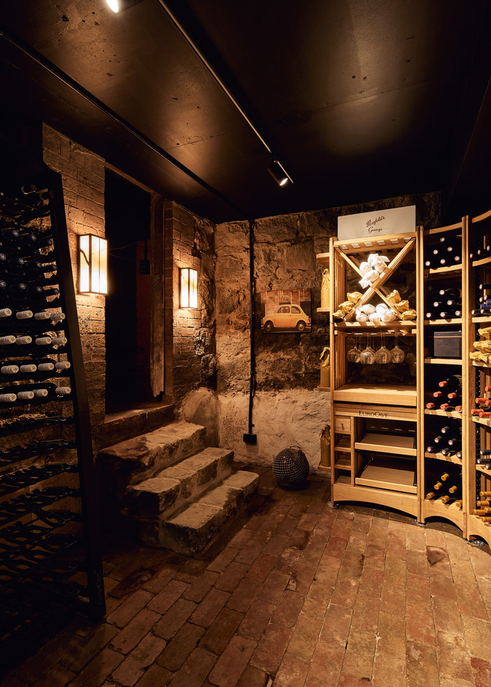 Small wine cellar in Melbourne with brick flooring, storage racks and multi-coloured floors.