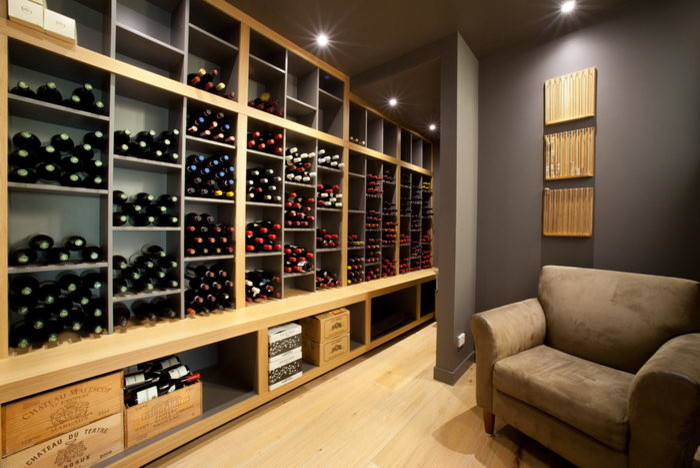 Wine cellar - mid-sized contemporary light wood floor wine cellar idea in Brisbane