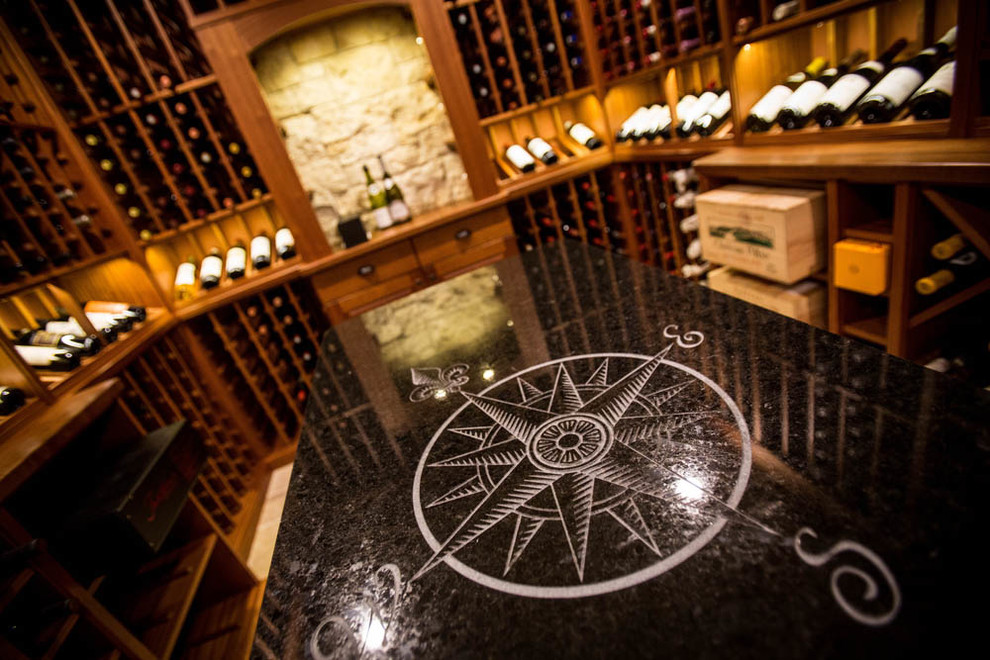 Photo of a traditional wine cellar in Boston with display racks and travertine flooring.