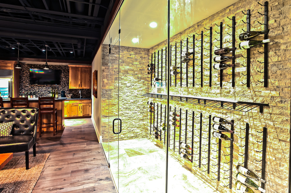 Inspiration for a mid-sized transitional ceramic tile and beige floor wine cellar remodel in Chicago with display racks
